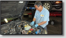 Mechanic Working on Engine at Precise Auto Service
